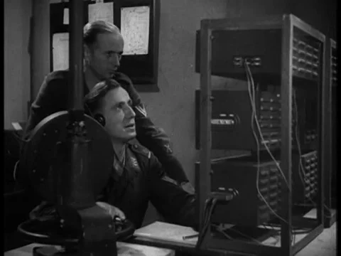 Nazis type information and message it via ticker tape picked up by women at aƒ Stock Footage 75291596