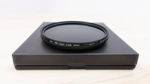 ND filter with case on bright background Foto stock