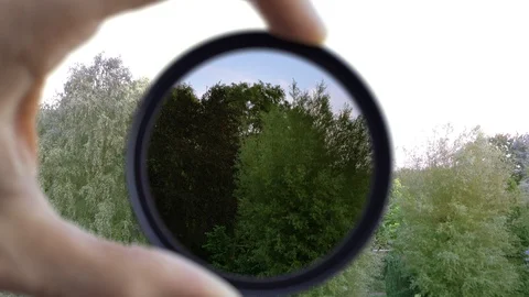 ND filter exposure adjust demonstration for camera lens (4K) Stock Footage 91967109