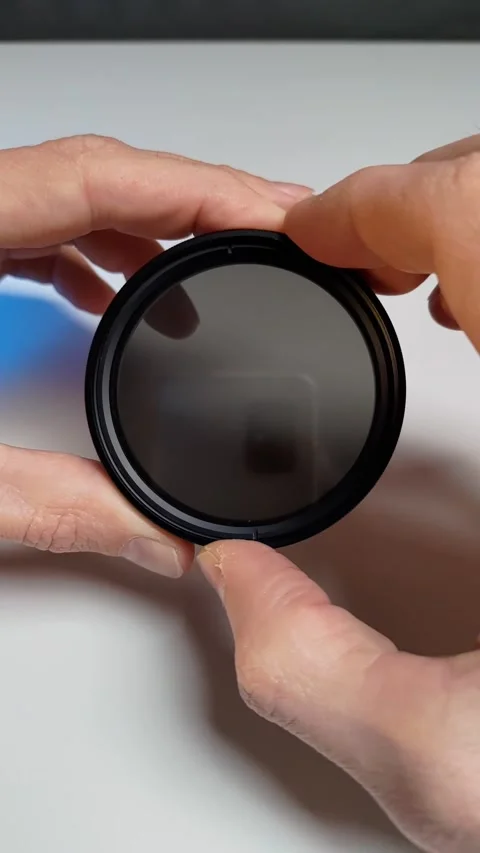 Nd filter with variable density in male hands.  work example Stock Footage 237763270