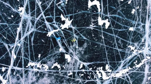 Near-Vertical View of Cracked Transparent Ice on Lake Baikal Video stock 342235600