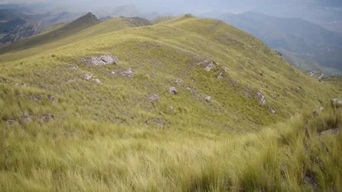 Nearby mountain range with cloudy sky in the background Stock Footage 274512960