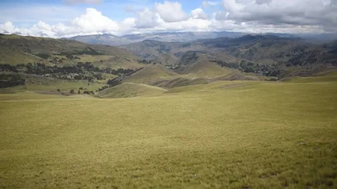 Nearby mountain range with cloudy sky in the background Stock Footage 274512963