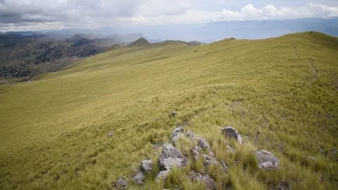 Nearby mountain range with cloudy sky in the background Stock Footage 274512964