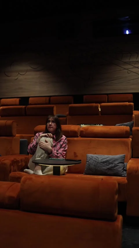 Nearly empty cinema with few viewers watching movie Stock Footage 333510933