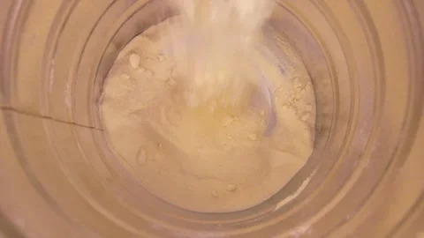 Nearly Empty Milk Powder Container with Spoon Stock Footage 346302319