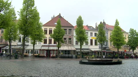 Nearly empty pedestrian square with bad weather, Bruges Stock Footage 55376669