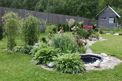 Neat beds on the garden plot. Beautiful beds with seedlings. 스톡 사진