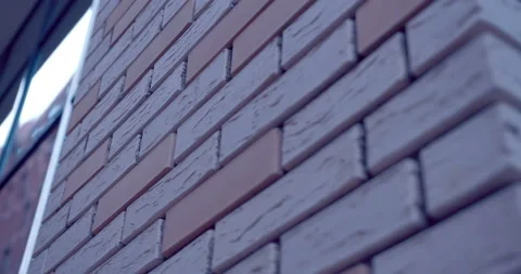 Neat bricks in modern brickwork and large glass windows reflecting building  Stock Footage 119619428