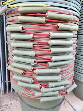 Neat stack of multi-colored buckets in a builder's shop Stock Photos