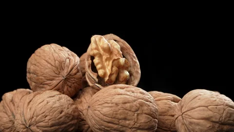Neatly Arranged Shelled Walnut Kernels Rotating Black Background Stock Footage 332524853