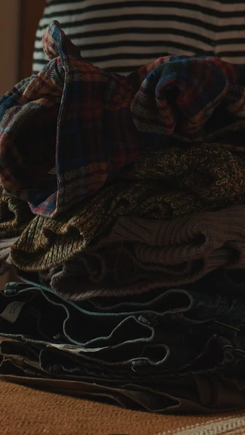 Neatly Folding And Stacking Clothes In A Home Setting Stock Footage 330494071