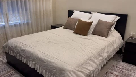 Neatly Made Double Bed in a Modern Bedroom Video stock 345741151