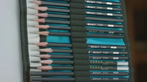 A neatly organized roll-up case of graphite pencils in various hardness levels Stock Footage 302900075