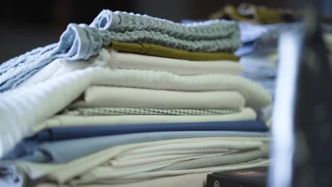 Neatly Stacked- Close-Up of Folded Fabrics and Towels, Neatly Folded, Stock Footage 287643896