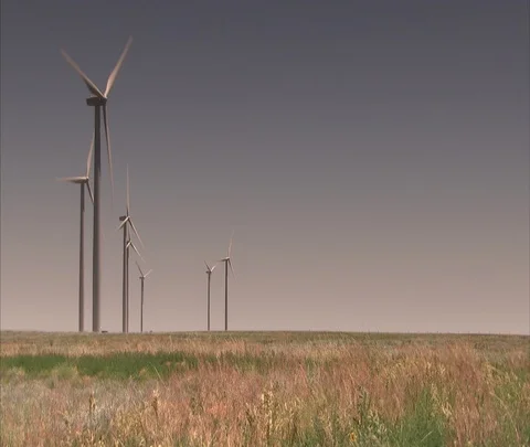 Nebraska to Denver, CO; WS Wind turbines turning in flat field Stock Footage 86690751