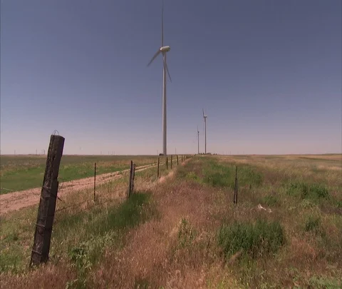 Nebraska to Denver, CO; WS wind turbines in flat field Stock Footage 86690776
