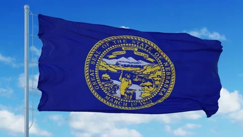 Nebraska flag on a flagpole waving in th... | Stock Video | Pond5