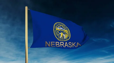 Nebraska flag slider style with title. Waving in the wind with cloud background Stock Footage 48173196