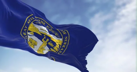 Nebraska state flag waving in the wind on a clear day Video stock 252259387