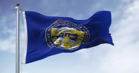 Nebraska state flag waving in the wind on a clear day Stock Footage 280573269