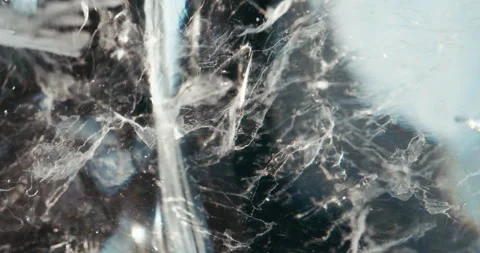 Nebula of air bubbles in an ice block Stock Footage 255876710