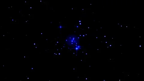 Nebula dust particles sparkling in deep space against a dark cosmic backgroun Video stock 346803468