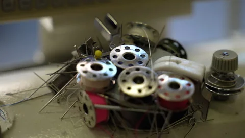 Necessary equipments for sewing process on magnet in workshop, metal reels with Stock Footage 255438825