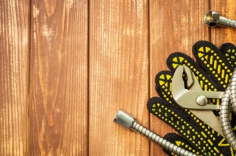 Necessary set of tools for plumbers on a vintage wooden wooden background. Stock Photos