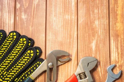 Necessary set of tools for plumbers on a vintage wooden background. Stock Photos