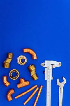 Necessary set of tools for plumbing isolated on blue background with space fo Stock Photos