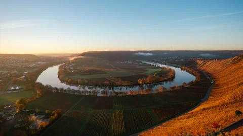 A Neckar valley with a 180° bend of the river and vineyards on a cloudy day Stock Footage 221369038