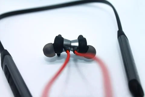 Neckband image. Bluetooth headset image. Red wired bluetooth earphones. Wirel Stock Photos