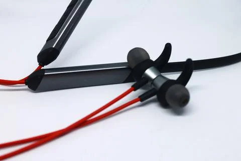 Neckband image. Bluetooth headset image. Red wired bluetooth earphones. Wirel Stock Photos