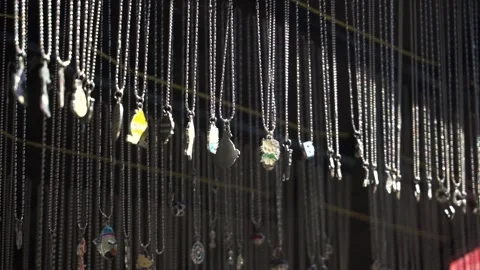 A necklace dangles in the wind. Stock Footage 325441087