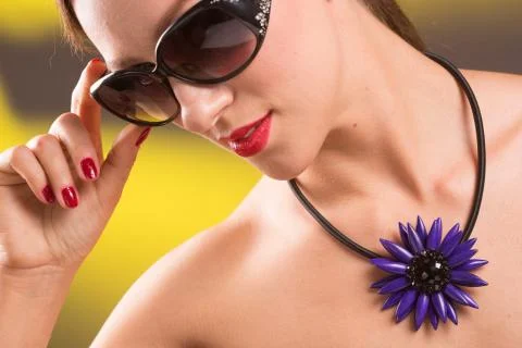 Necklace on the neck. ruby and emerald Stock Photos
