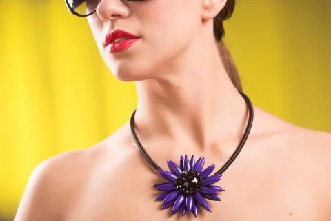 Necklace on the neck. ruby and emerald Stock Photos