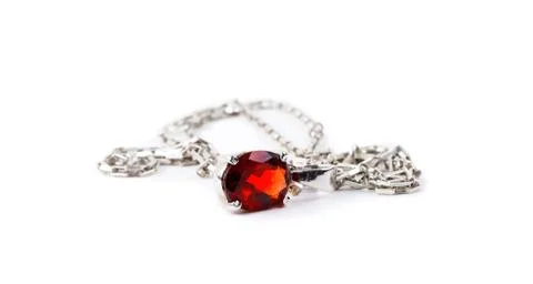 Necklace with the ruby stones on the white Stock Photos