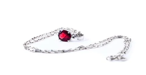 Necklace with the ruby stones on the white Stock Photos