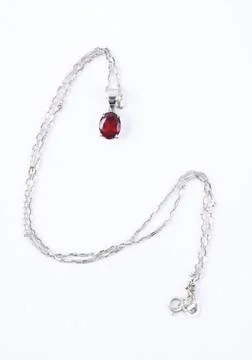 Necklace with the ruby stones on the white Stock Photos