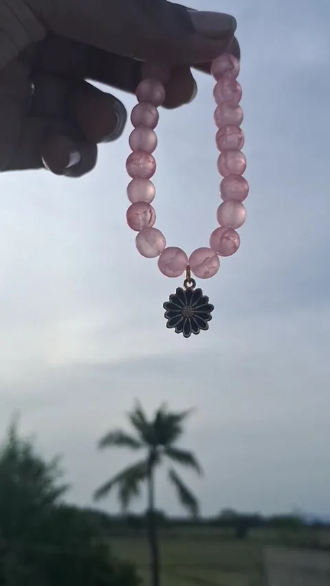 Necklace on a stone with a sky background Stock Footage 305663357