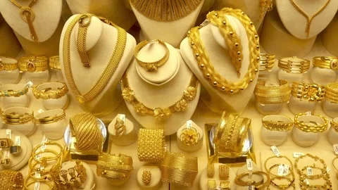 Necklaces, rings, bracelets and chains are displayed on stands Stock Footage 333926155