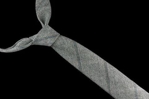 Necktie in wool with dog tooth pattern Stock Photos