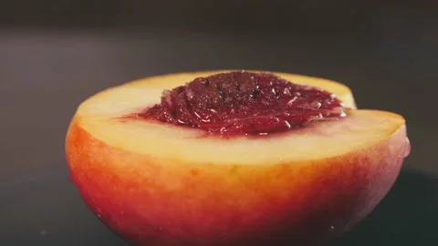 Nectarine with bone in a cut close-up rotates Stock Footage 165991484