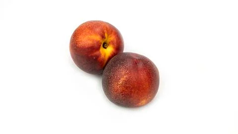 Nectarine on a white background from different sides. Macro photo. Stock Photos