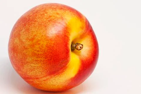 A nectarine on white background Stock Photos