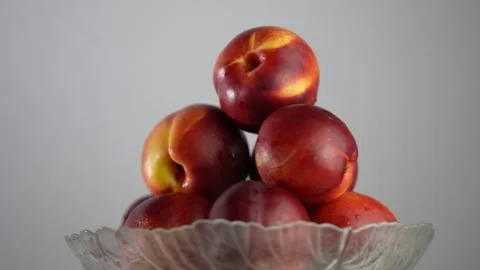 Nectarines Plate with nectarines. Peaches close-up Stock Footage 248442876