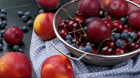 Nectarines, sweet cherries, blueberries on a wooden table, autumn fall harvest Stock Footage 157683953