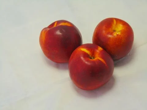 Nectarines on white background. Stock Photos
