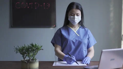 Need Help. Asian doctor asking people about their health. A doctor stands in Video stock 130243128